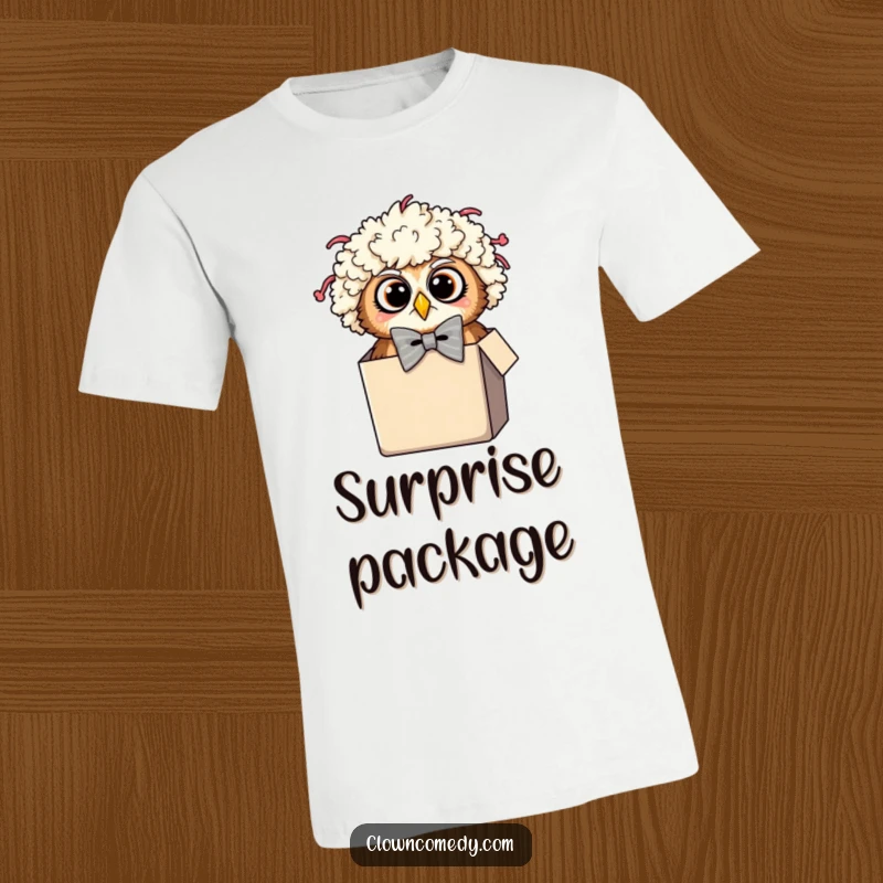 Funny Owl Clown T-Shirt: A surprised owl in a clown wig and oversized bowtie peeking from a tiny box, a wearable gag.